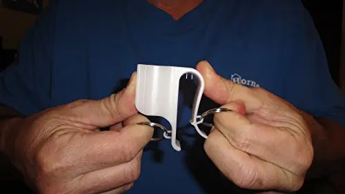 Horne Golf white nylon putter clip holder attached to the side of a golf bag